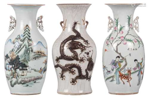 Two Chinese famille rose and polychrome vases; added a stoneware dragon relief baluster vase, marked, ca. 1900, H 42,5 - 43 cm