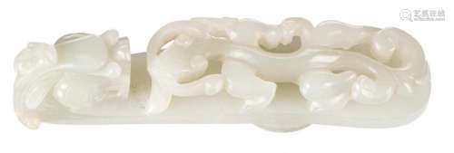 A Chinese dragon relief decorated jade belt buckle, L 9 cm