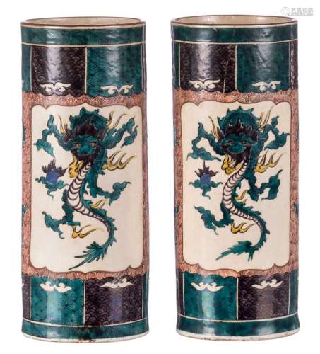 A pair of Oriental cylinder shaped polychrome decorated vases, depicting a dragon and a river landscape, marked, 19thC, H 36 cm (damage)
