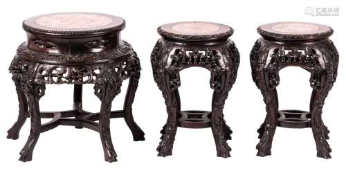 A pair of Chinese hardwood carved stools with marble top, about 1900; added a ditto stool, H 46 - 47,5 cm