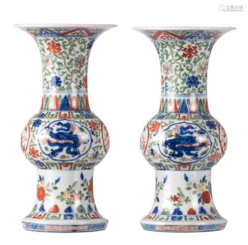 A pair of Chinese wucai floral decorated yenyen vases, the roundels decorated with dragons, with a Wanli mark, H 23,5 cm