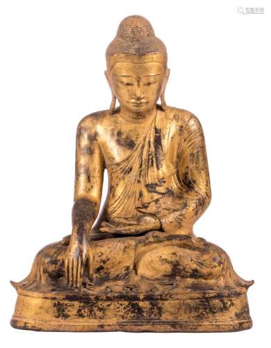 An Oriental gilt bronze seated Buddha, 19thC, H 57 - W 43,5 cm