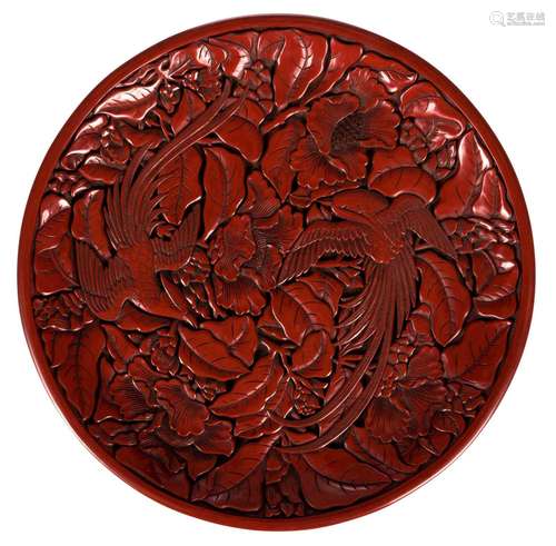 A Chinese red lacquer relief plate, decorated with birds and flowers, Qing dynasty, Diameter 30,5 cm