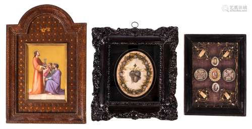 A frame with relics, so-called 'begijntjeswerk' (beguines work), 19thC, 14,5 x 19 cm; added a religious image painted on porcelain in a maroquin leather coated list, second half of the 19thC, 20 x 29,5 cm; extra added H. Heart of Jezus, engraving in a Glomi frame, 20 x 25 cm