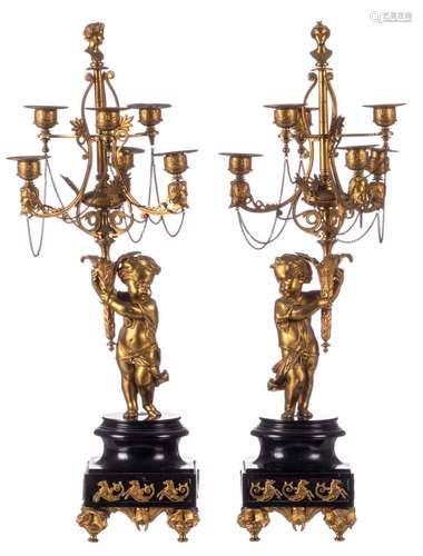 A pair of gilt bronze candlesticks on a black Rance marble base, late 19thC, H 67 cm