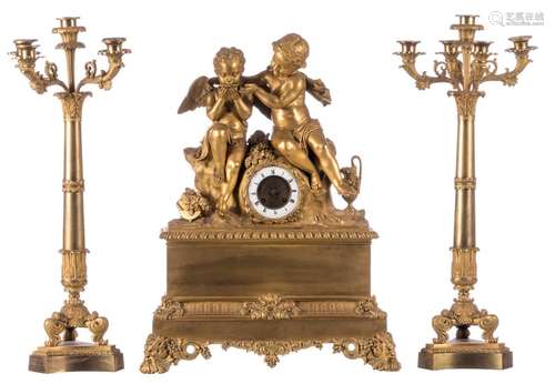 A gilt bronze mantel clock decorated with a charming scene referring to love and abundance and the two accompanying candlesticks, mid 19thC, H 57 - 60 cm