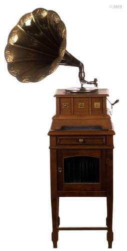 A gramophone, early 20thC, with added a cabinet, H 87,5 (gramophone) - 89 cm (cabinet); added some music records