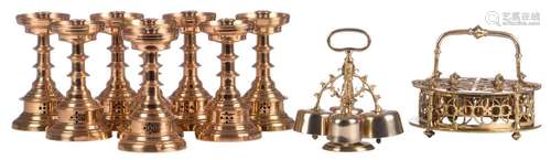 Two Gothic revival brass ceremonial bells; added eight ditto candlesticks, H 20 cm