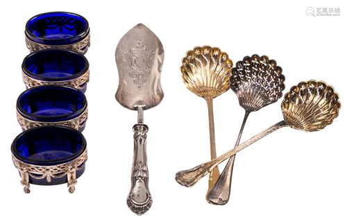 Four silver salts with blue crystal inner bowls, marked Gent 1773; added a pair of gilt silver casters, French, 950/000, 19thC; extra added a silver caster, French, 19thC and an extra silver cake spoon, French, 19thC, remarked 1830-1868, Total silver weight: about 450g