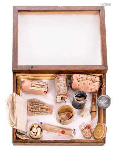 A table vitrine with relics of various saints, with certificates, 33,5 x 43,5 cm