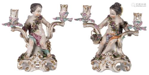 A pair of polychrome decorated candelabras depicting Venus & Amor, marked, probably Meissen or Paris, 19thC, some damage, H 29,5 - 30 cm (some damage)