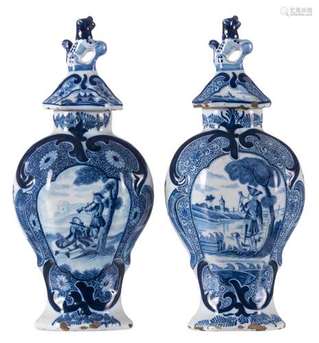 Two blue and white Delft vases and covers, one marked AK ('De Witte Starre') and one marked 'De Drye Klokken', 18thC, H 34 cm