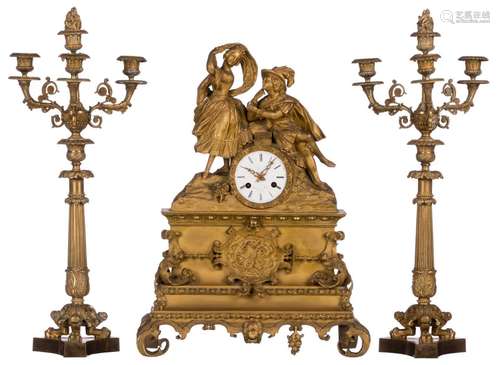 A gilt bronze three-piece garniture, the dial marked 'Mansion Père à Namur', second half of the 19thC, H 51 (pendulum) - 56 cm (candlesticks)