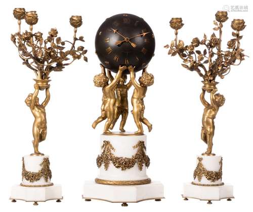 A bronze and patinated bronze garniture on a white marble base, de clock itself globe shaped and worn by putti, with the matching ditto candelabra, marked H. Luppens - Bruxelles, late 19thC, H 52 cm