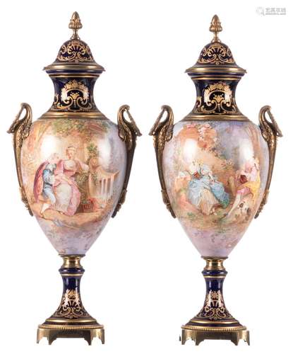 A pair of ornamental Sèvres vases with gold-layered bleu royal ground, decorated with gallant scenes and bronze mounts, signed and marked, H 49 cm