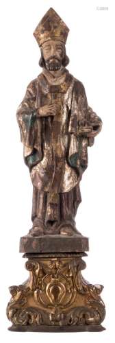 A polychrome painted wooden statue of a Saint, with an accompanying base, 18thC, H 59 (without base) - 78 cm (with base)