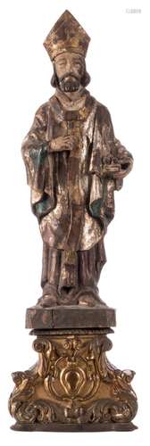 A polychrome painted wooden statue of a Saint, with an accompanying base, 18thC, H 59 (without base) - 78 cm (with base)