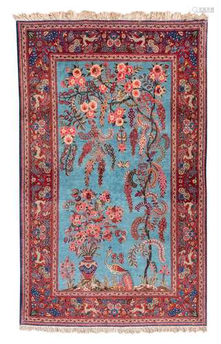 An Oriental rug, decorated with deer, birds and flower branches, Kashan, wool on cotton, 128 x 206 cm