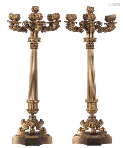 A pair of gilt bronze Historism candlesticks, H 62 cm