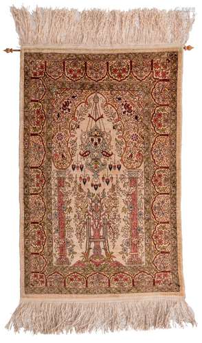 An Oriental silk prayer rug with floral and geometric motifs, marked, 44 x 90 cm