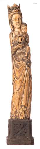 Our Lady and child and boat, patinated ivory on a wooden Gothic revival base, probably workshop Heckman Paris, early 20thC, H 74,5 (without base) - 90,5 cm (with base) - Total weight about 9600g