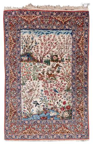 An Oriental rug, floral decorated, the roundel with deer and ducks, wool on cotton, 144,5 x 218 cm