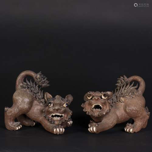 A PAIR OF SHIWAN STONE CARVED LIONS