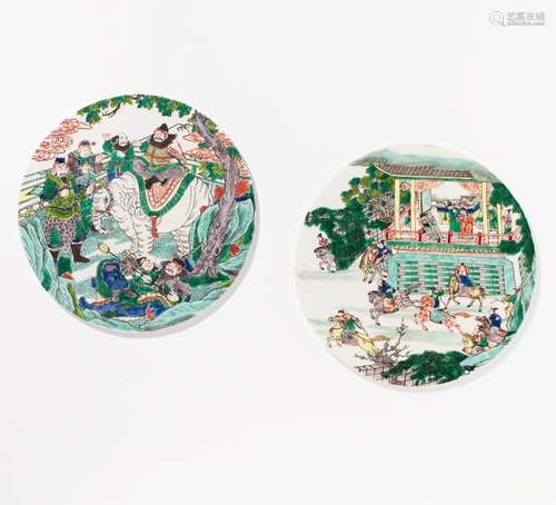 TWO CIRCULAR PANELS WITH SCENES FROM THE NOVEL OF THE ROBBERS OF THE LIANGSHAN PO.