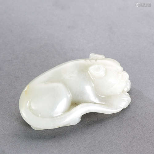 A CHINESE WHITE JADE CARVING OF A TIGER