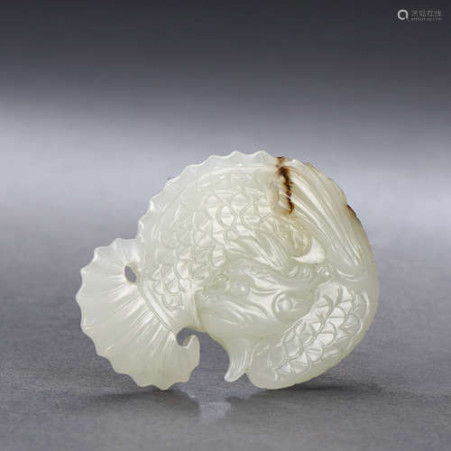 A CHINESE WHITE AND RUSSET JADE DRAGON-CARP PENDAN