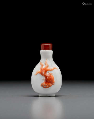 Jingdezhen kilns, 1821-1850 A finely molded and iron-red painted porcelain 'goldfish' snuff bottle