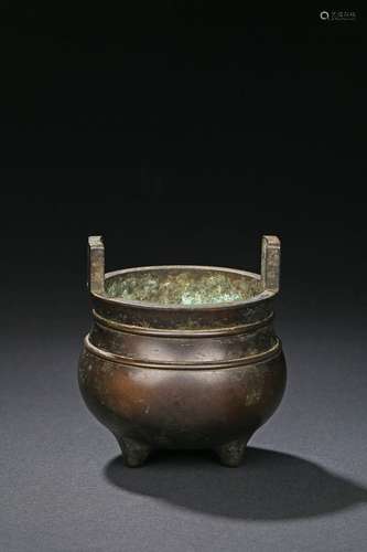 A globular bronze tripod censer