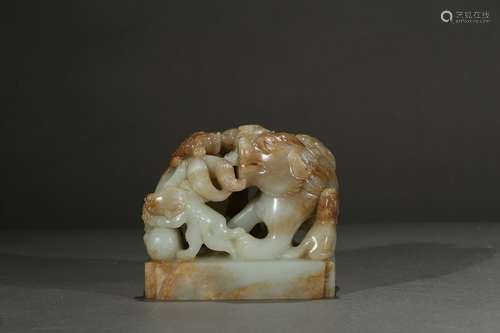 A jade carved 'nine-buddhist lion' seal