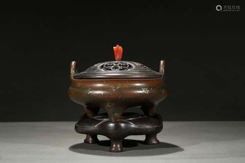 A gilt-splashed bronze tripod censer