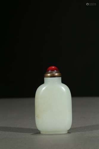 A white jade carved snuff bottle