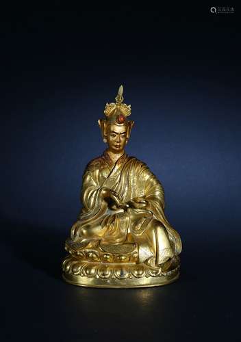 A gilt-bronze figure of Padmasambhava