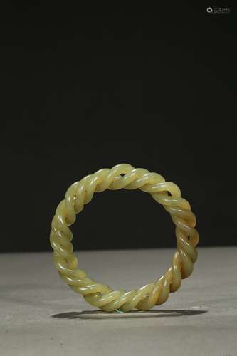 A yellow jade rope-twisted bangle