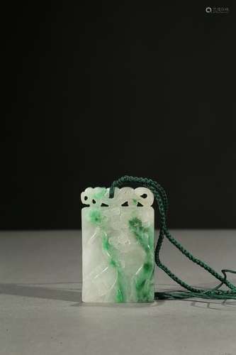 A jadeite carved 'crane and pine' pendant