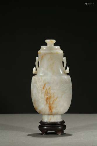 A white jade 'taotie mask' baluster vase