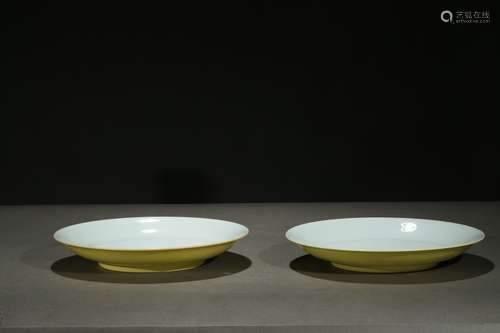 A pair of yellow glazed incised dishes