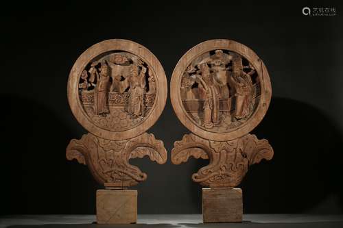 A pair of wood 'figures' screen panels