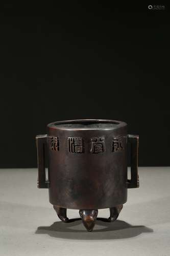 A bronze tripod elephant-feet censer