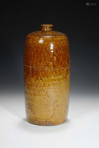 A brown glazed cylindrical vase