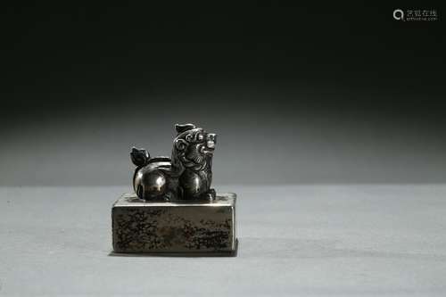 A silver square 'mythical beast' seal