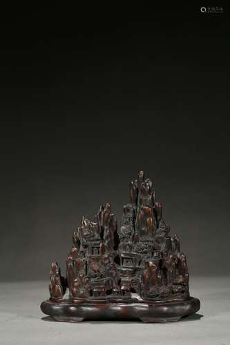 An agarwood carving of mountain landscape