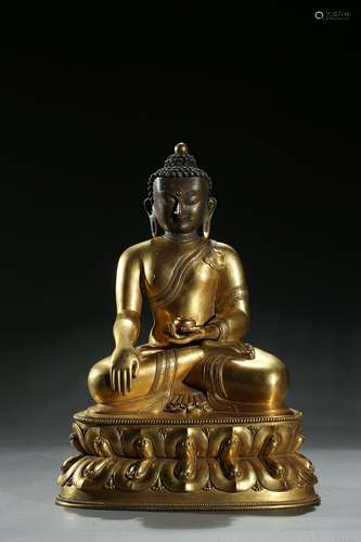 A gilt-bronze figure of Shakyamuni