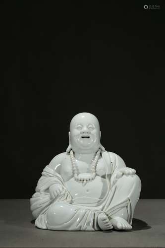 A Dehua white glazed figure of Maitreya