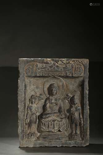 A stone 'buddhist and attendants' panel