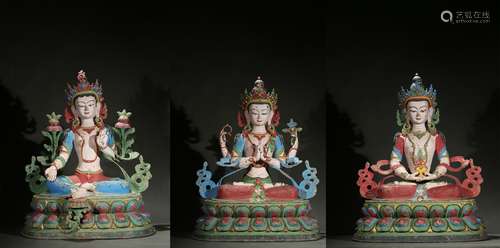 A set of three large painted bronze bodhisattvas