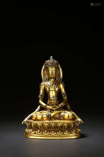 A gilt-bronze inlaid amitayus figure